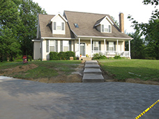 New front concrete walkway, steps and concrete driveway replaces the old unsafe concrete at this home in Erie, PA.